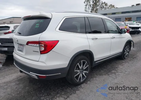 2021 Honda Pilot 2Wd Touring 8 Passenger z USA, uszkodzony, nr VIN 5FNYF5H91MB010304